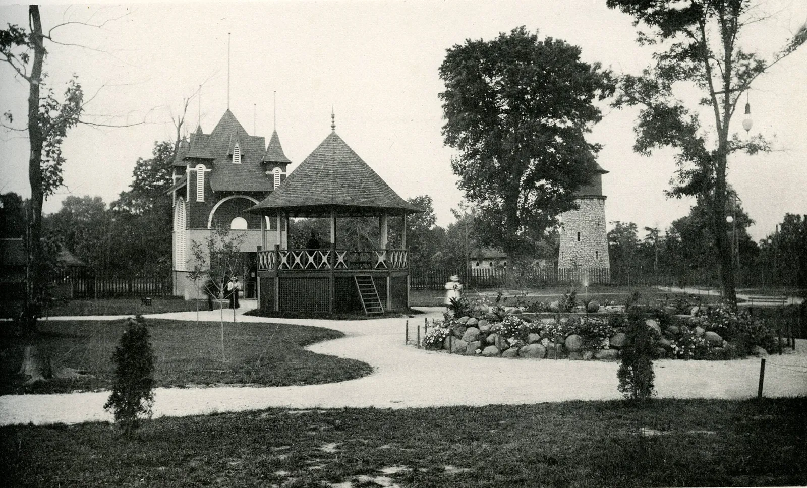 Photograph taken in Columbus, Ohio c. 1897. "View of Minerva Park featuring the jail, water tower, wishing well and entrance gateway. Minerva Amusement Park deb