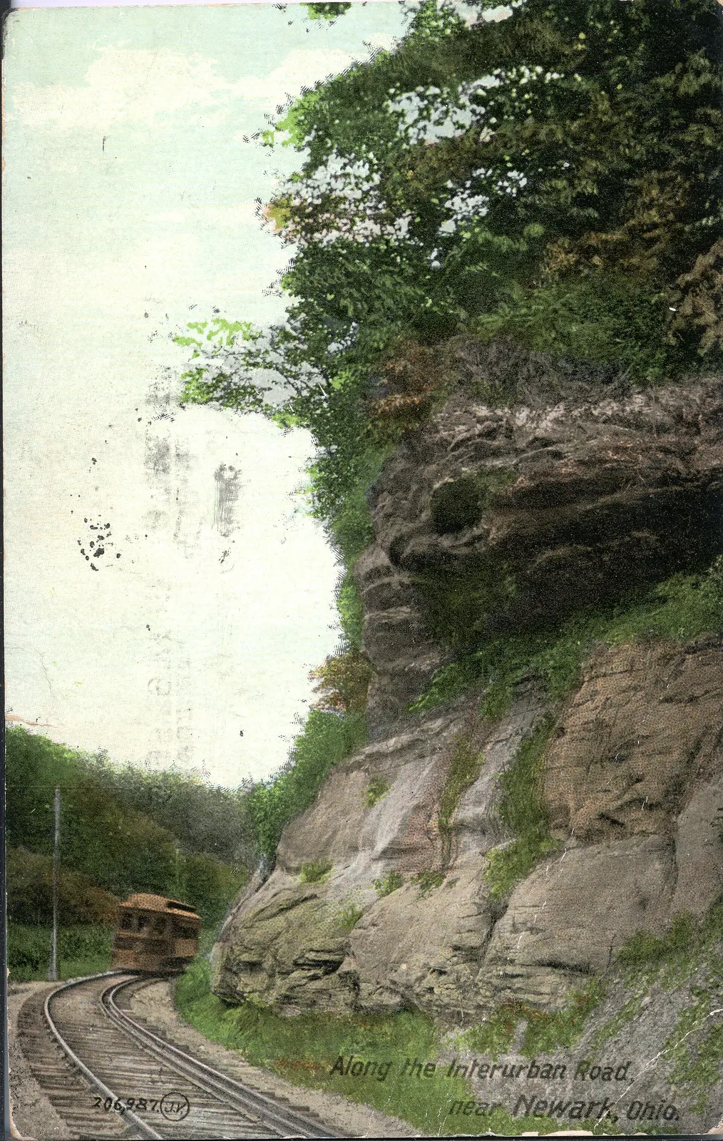 Color postcard showing the interurban road in Newark.