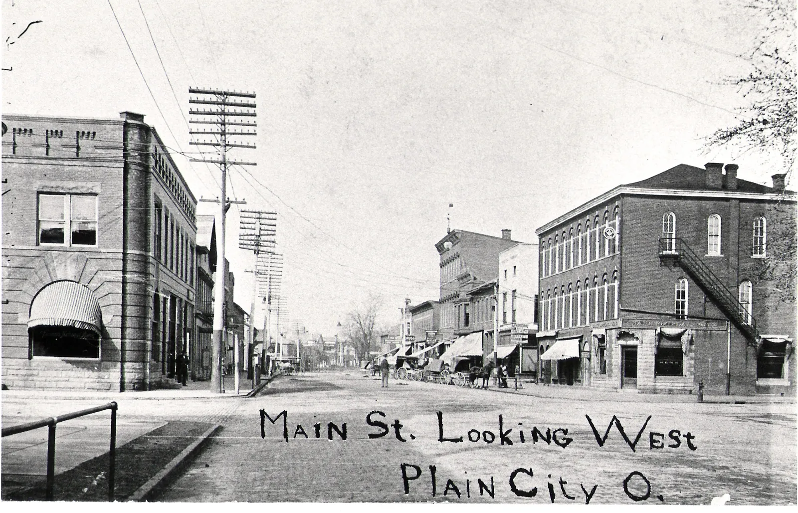 A 1906 photo of West Main Street, en:Plain City, Ohio. Taken by Henry Wenzel. This photo appeared in the November 21, 1906 issue of the Plain City Advocate.