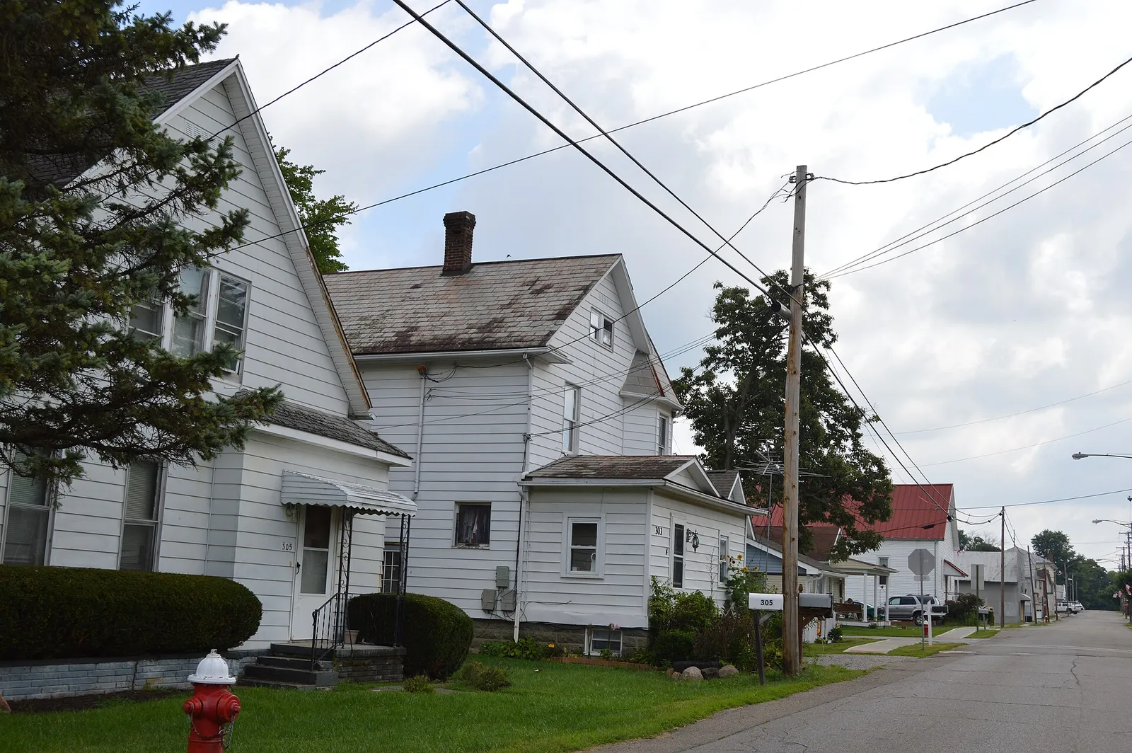 Houses on the northern side of Columbus Street at the Walnut Street intersection in Pleasantville, Ohio, United States.