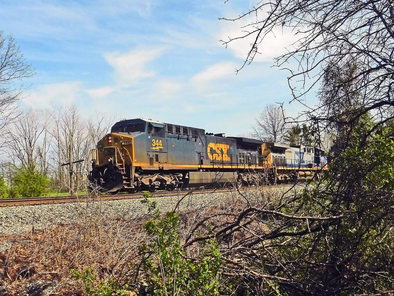 A CSX Locomotive pulls a train north on the Columbus Subdivision through milepost 14.0 in Powell, Ohio.