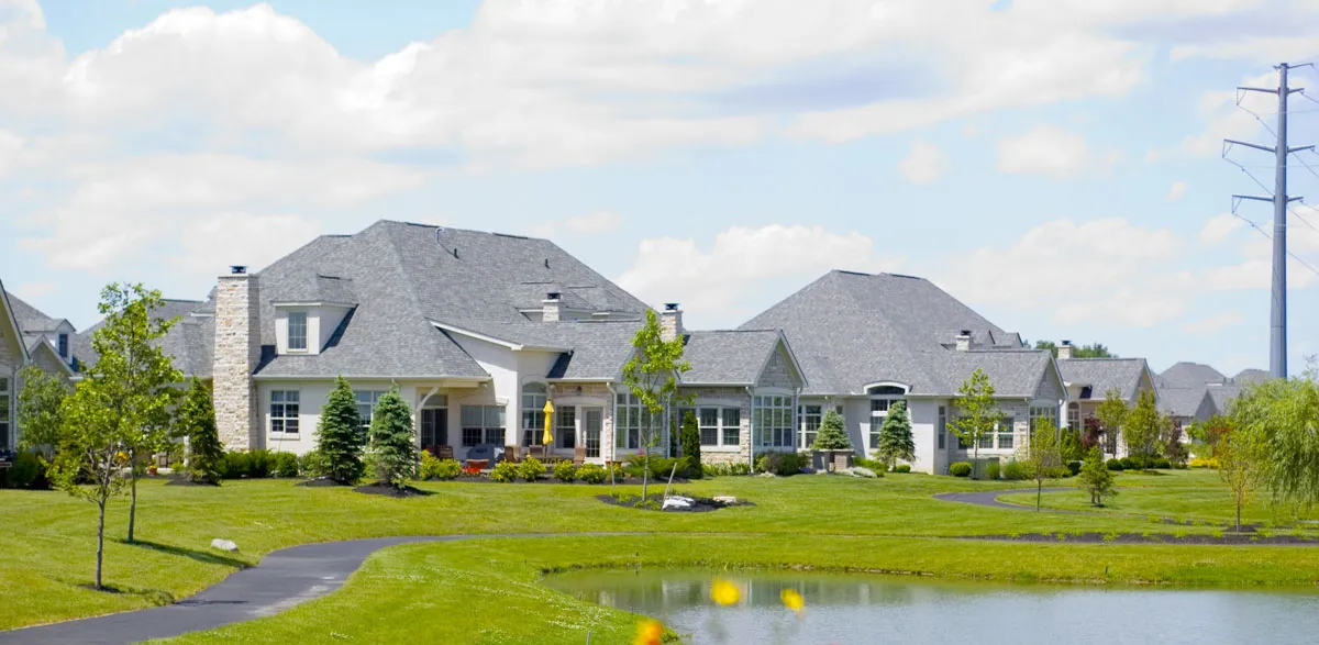 Rear of houses on Dolman Drive just northwest of the intersection of Rutherford Road and Sawmill Parkway in Powell, Ohio, United States.