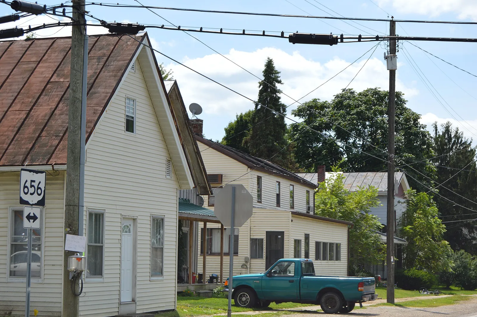 Houses on the southeastern side of Main Street (State Route 656) southwest of the Church Street intersection in Sparta, Ohio, United States.