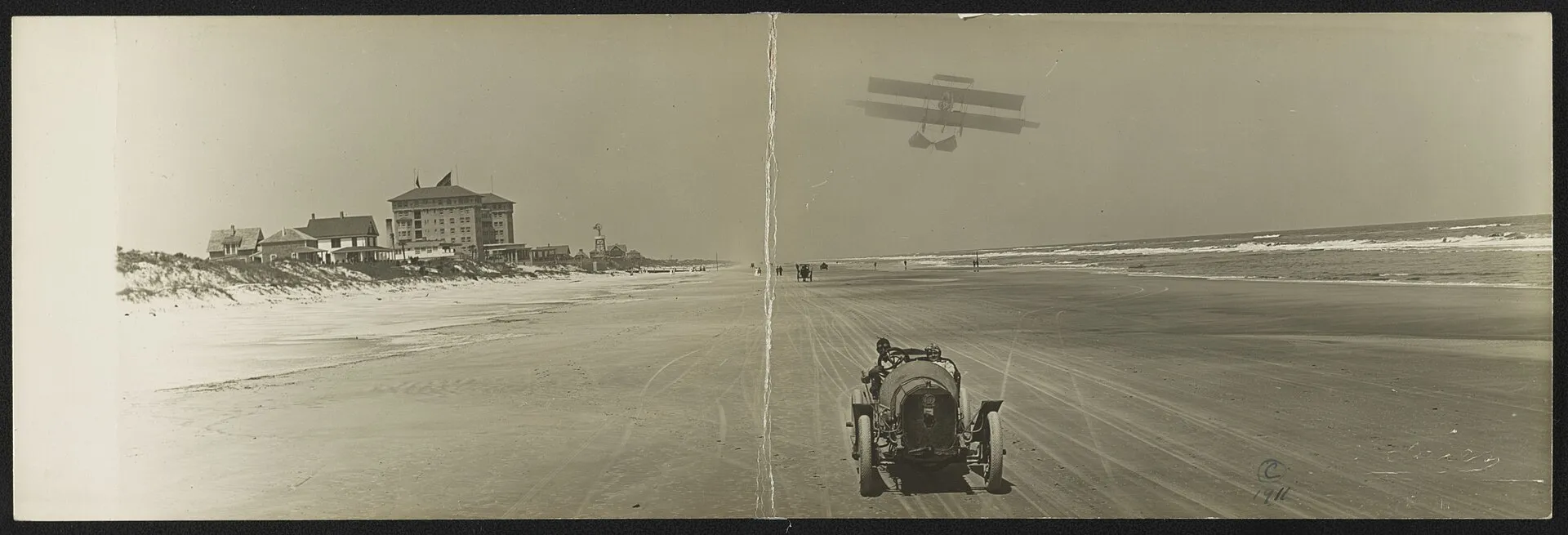 Vintage postcard: cars on the beach with an airplane overhead and the Clarendon Hotel in the background, Seabreeze, Daytona Beach.