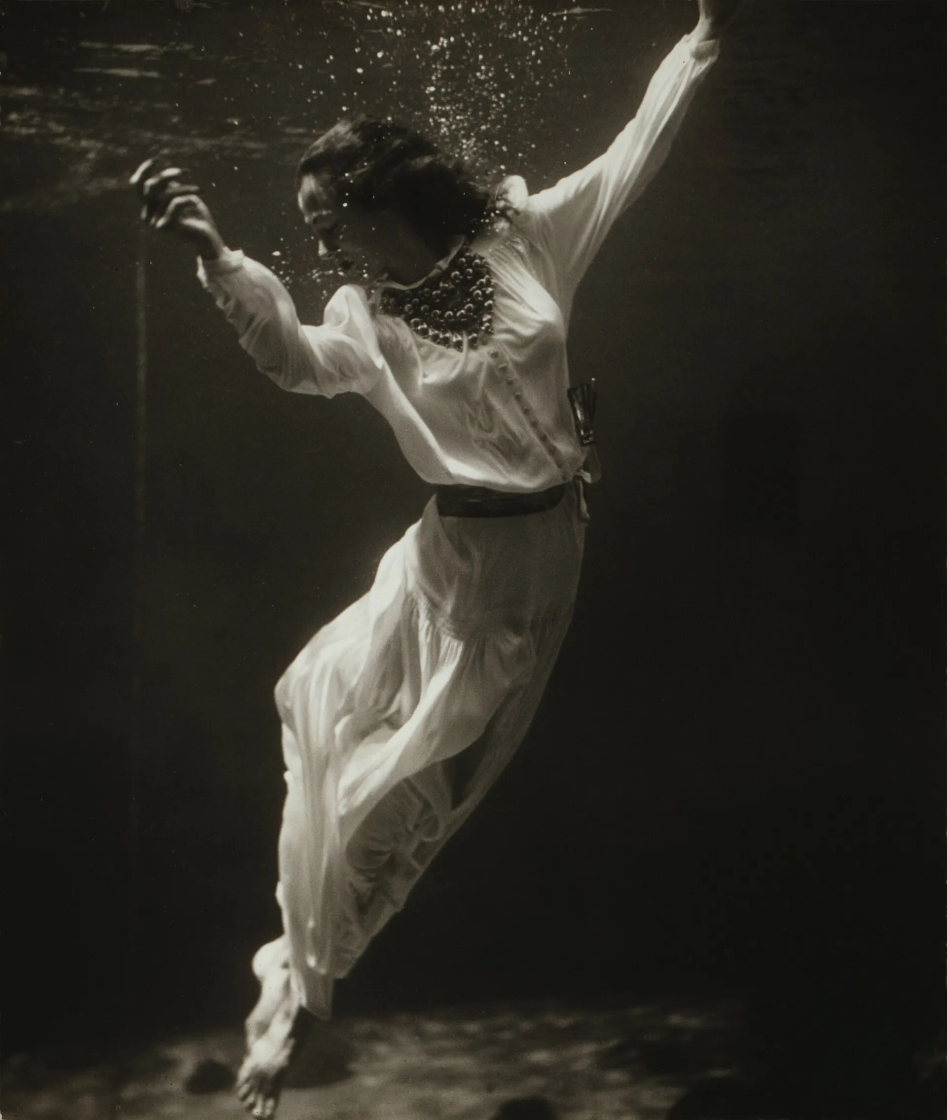 Fashion model underwater in the dolphin tank at Marineland, Florida (historic Library of Congress photo by Toni Frissell).
