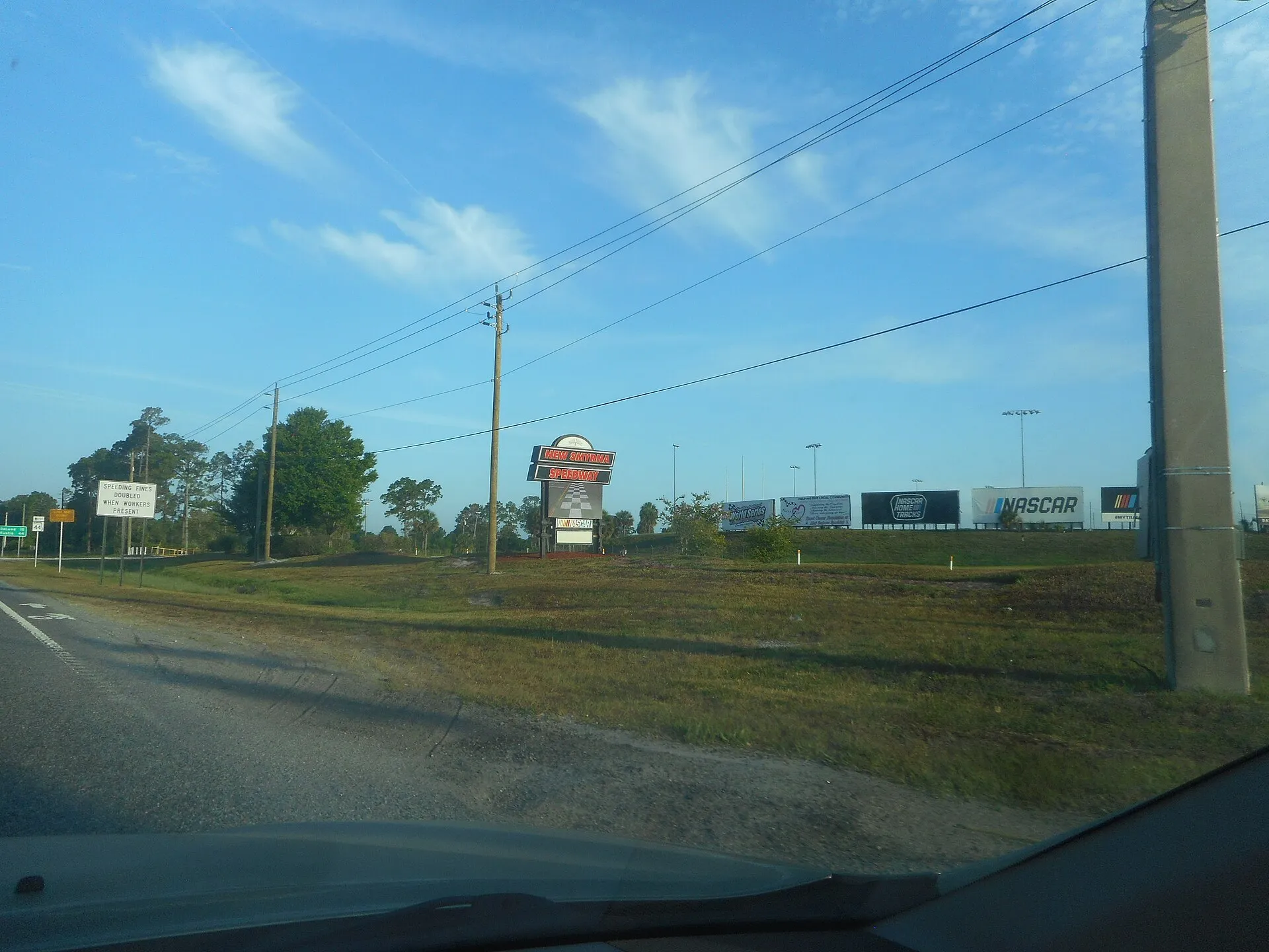 Sign for the New Smyrna Speedway as seen from westbound Florida State Road 44 in Samsula, Florida. The race track is actually on the northwest corner of SR 44 and Volusia County Road 415. Other photos of this sign exist in Wikimedia commons, but you've never seen it captured like this,