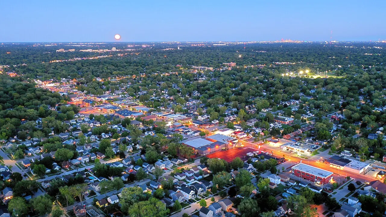 Downtown Berkley, Michigan (2022) looking southeast. Detroit's skyline can be seen on the horizon, Downtown Royal Oak near-horizon on the left.
