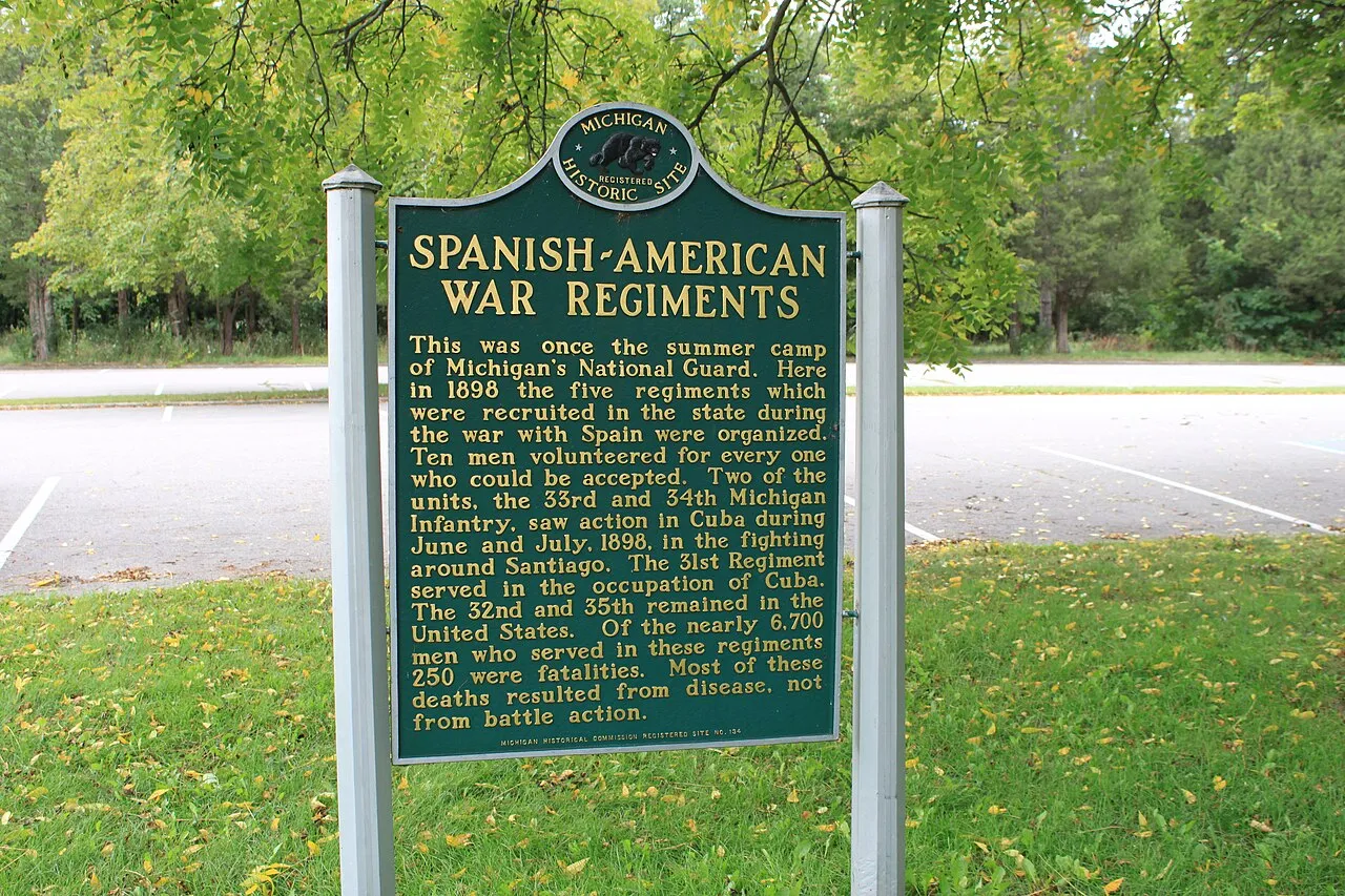 Spanish-American War Regiments historical marker, Island Lake Recreation Area, Brighton, Michigan. Although the state website says the marker is at the entrance of the park, it is actually a the western end of Kent Lake