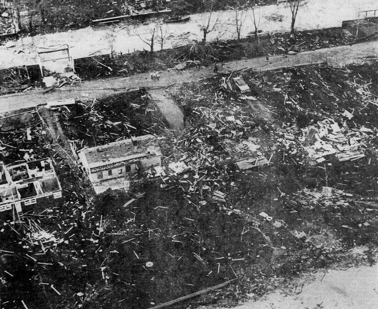 A low-flying aerial photograph of damaged/destroyed homes in Chesterfield Township, Michigan which were destroyed by a violent F4 tornado on May 8, 1964.