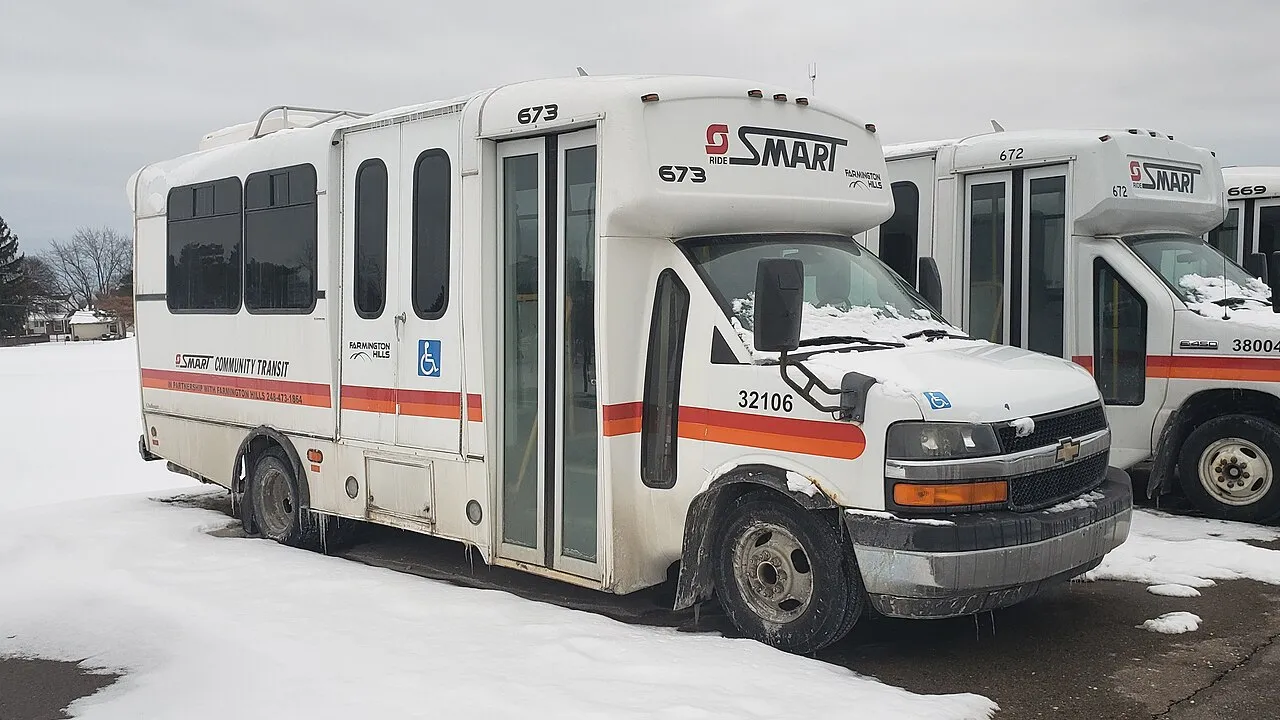 SMART Community Transit minibus 32016, a 2012 Champion Challenger built on a Chevrolet Express chassis, seen in Farmington Hills, Michigan. This vehicle is owned by SMART and operated by the City of Farmington Hills.
