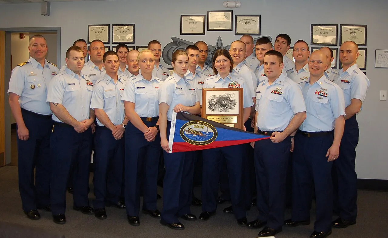 Crew members from Coast Guard Station Michigan City, Ind., display the Sumner I. Kimball Award for excellence, April 22, 2013. The crew accepted the award from Capt. Matthew Sibley, commanding officer of Coast Guard Sect