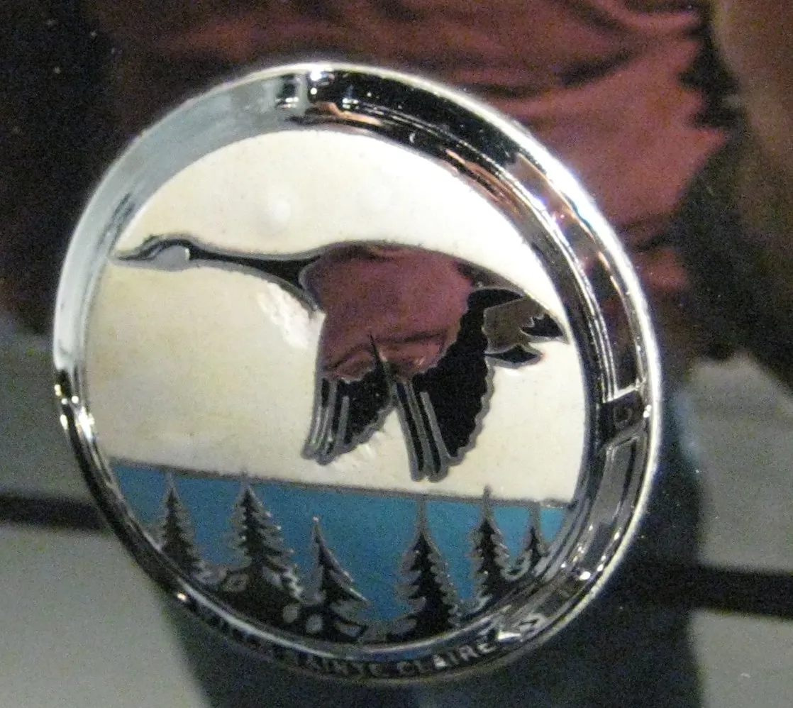Made in Marysville Michigan, Lake Saint Clair, radiator badge. Red color is reflection of my shirt. At AACA Museum in Hershey, Pennsylvania. Each car has volunteers who come in regularly to keep it polished.
