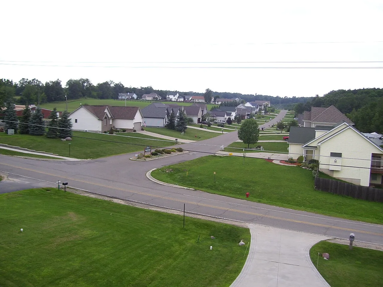 A view of Jamestowne Dr. in Metamora Michigan. The photograph was taken using a cheap digital camera modified to fit on a toy helicopter.