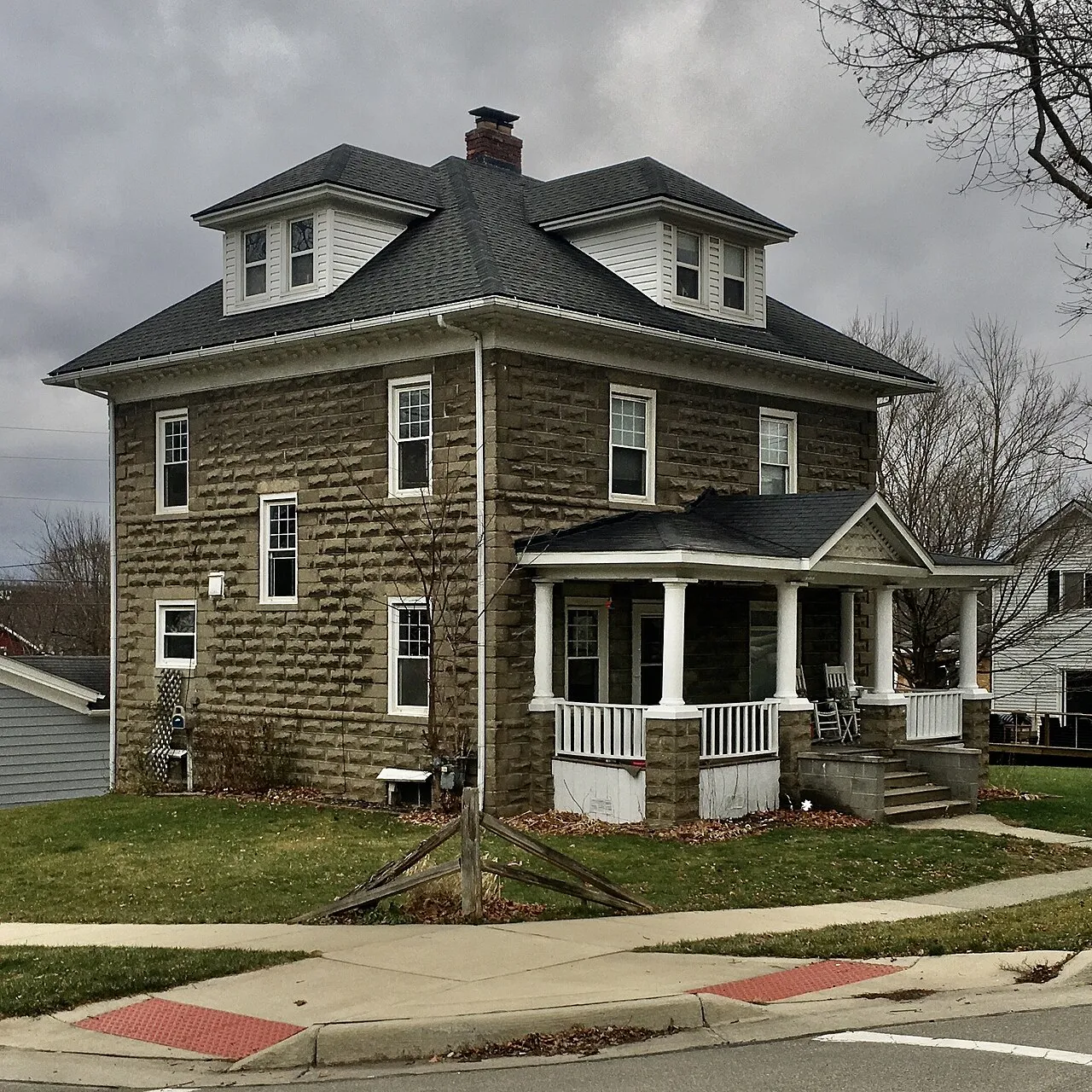 The H. J. Lee House, 322 East Commerce Street at East Street, Milford, Michigan, December 2020. A contributing property to the NRHP-listed North Milford Village Historic District, this house was built in 1906 of textured