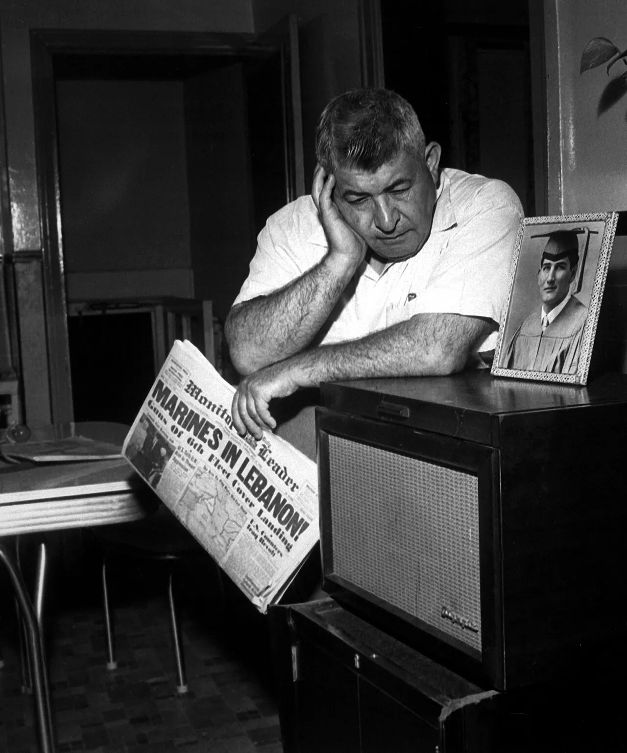 James Thaber, born in Lebanon, of Mount Clemens, Michigan, listens to President Eisenhower's broadcast of his decision to send troops to Lebanon.   His son, a recent high school graduate, is in the U.S. Army.  July 15, 1