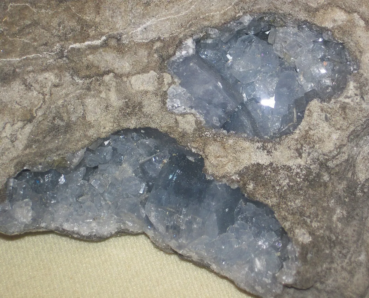 Celestite from Michigan, USA. A mineral is a naturally-occurring, solid, inorganic, crystalline substance having a fairly definite chemical composition and having fairly definite physical properties.  At its simplest, a