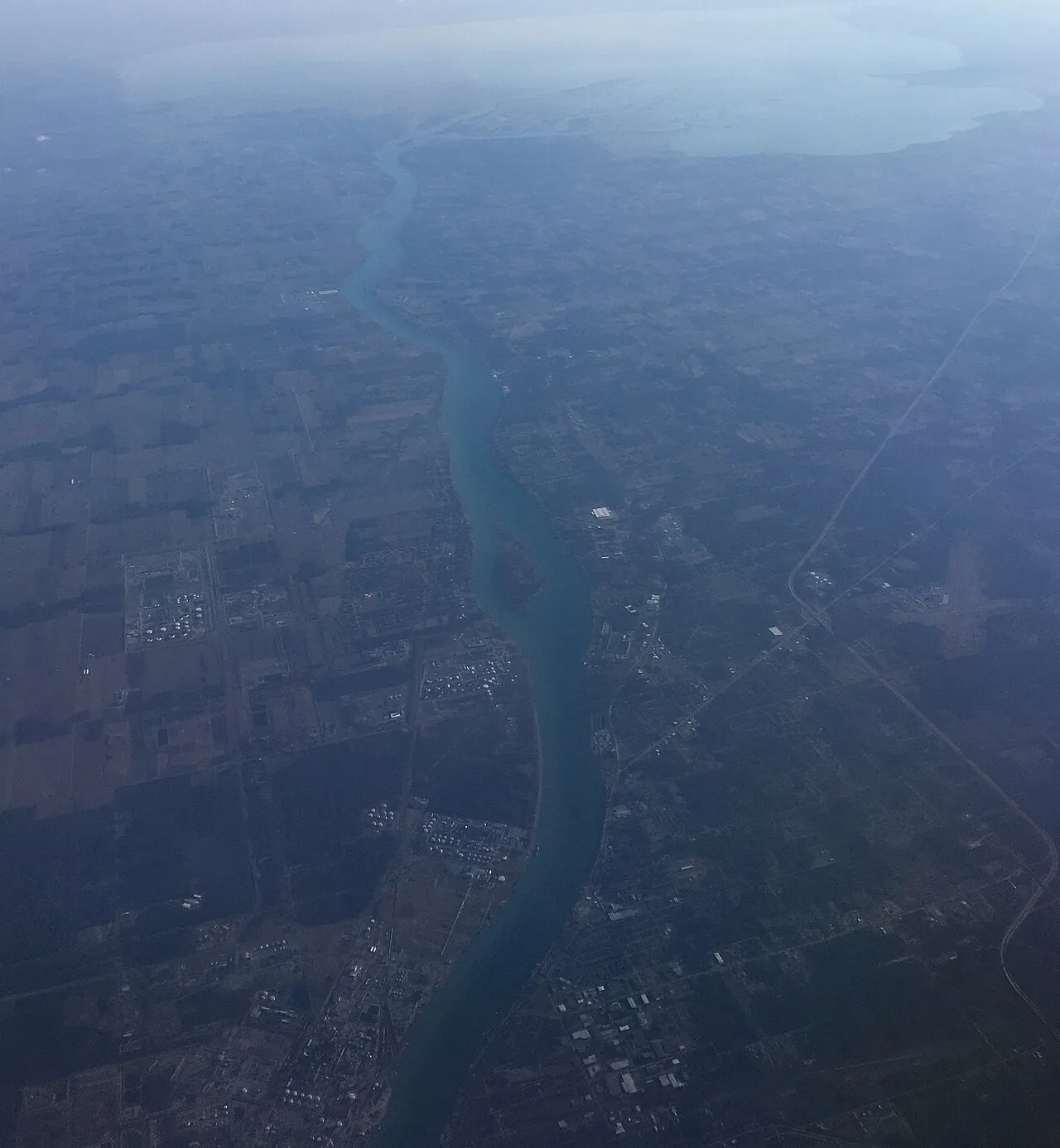 South-pointing view of the St. Clair River, which delineates the Michigan–Ontario border, and its mouth on Lake St. Clair