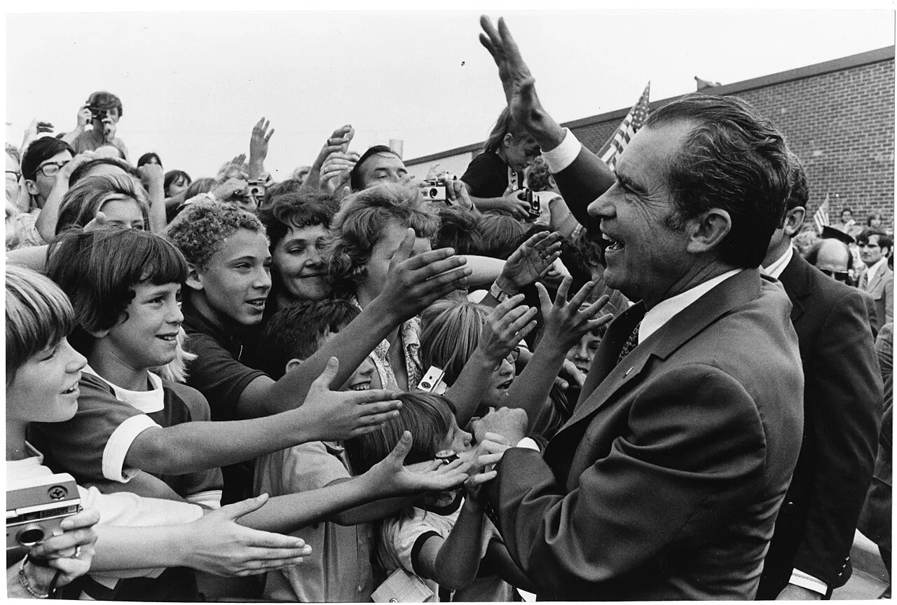 President Richard Nixon Greets a Crowd of Students outside a Building at Dwight D. Eisenhower High School in Utica, Michigan after Attending a School Dedication Ceremony - DPLA - 75fd3879f8e73fc800bea71bf6f3ea98.jpg