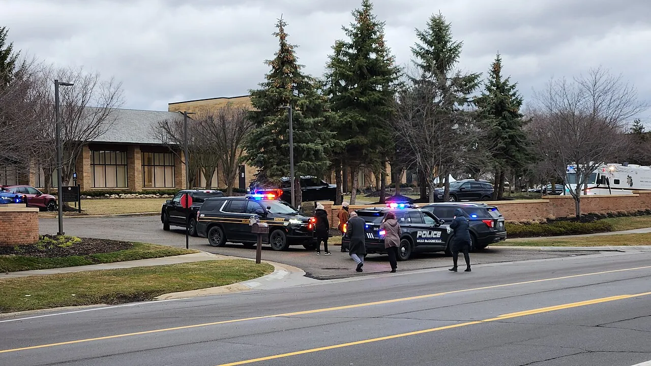 Police vehicles responding to the March 12, 2026 attack at Temple Israel in West Bloomfield, Michigan, parked at the entrance to Shenandoah Country Club across the road, the day after the attack.