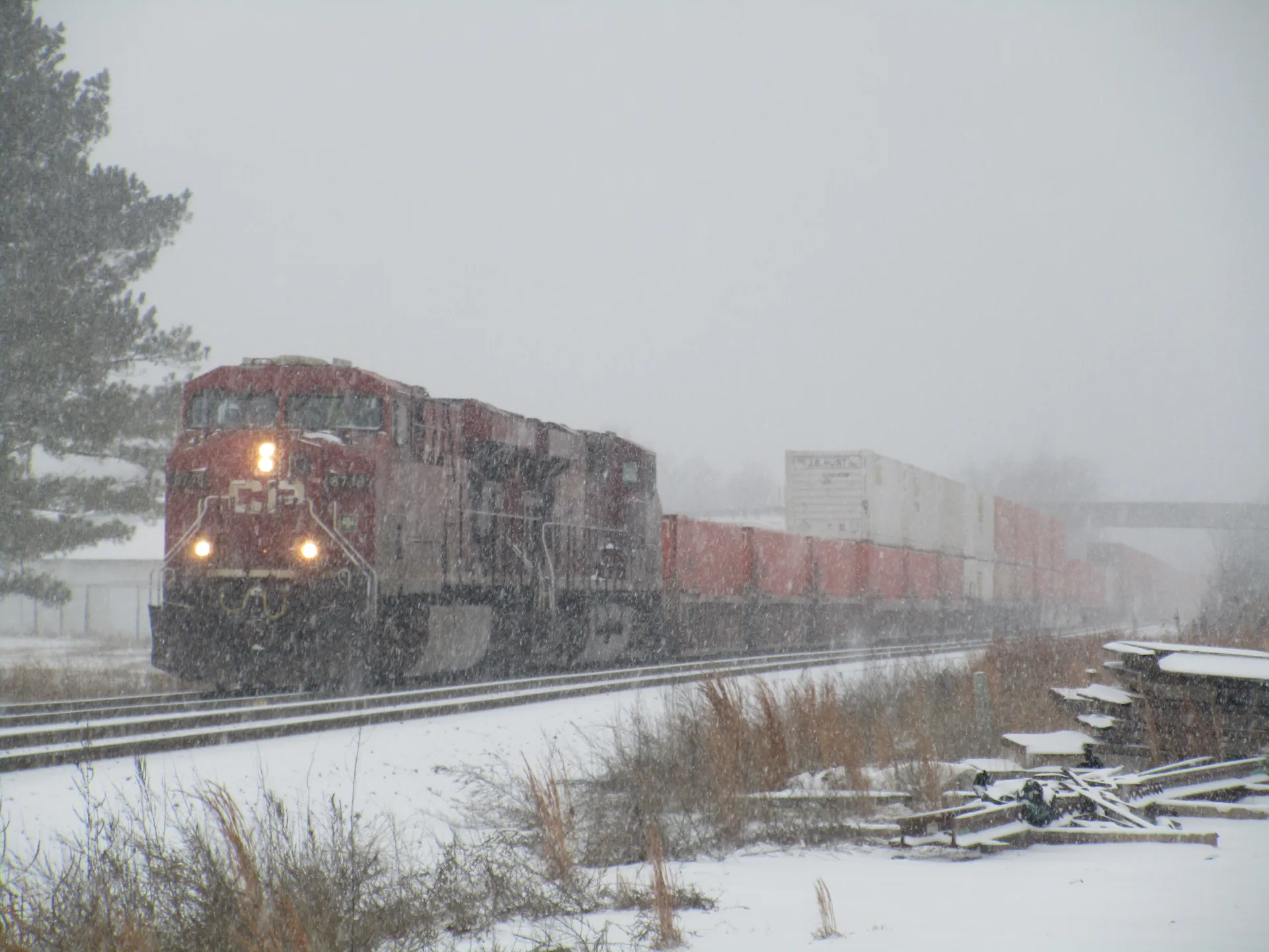 It's a funny red train in the snow.