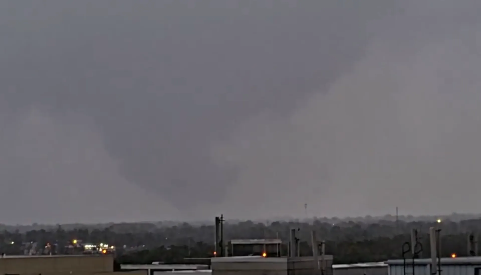 A photograph of the 2024 Rogers–Little Flock tornado seen from the Weatherbug Network Camera.