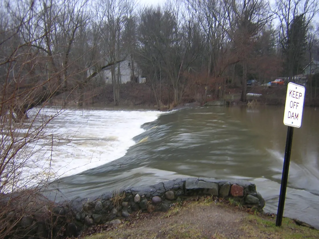 A view of the Nashville Dam in Nashville, Michigan on the Thornapple River. This image is from the SW upstream side, looking across the obstruction. This dam has no control gates, it is more of a weir.
