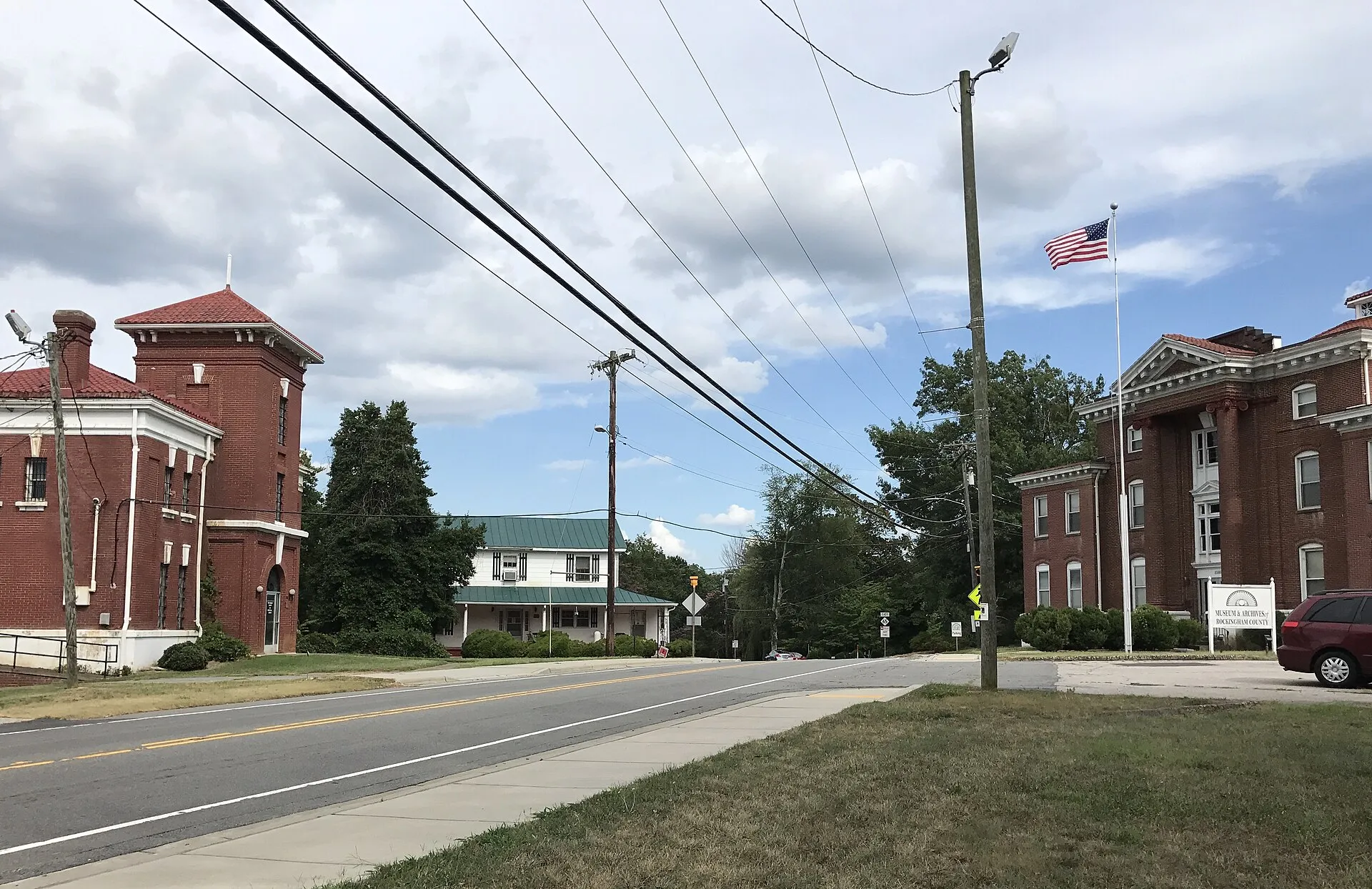 Center of Wentworth, North Carolina. The former Rockingham County Jail stands at the left, and the former Rockingham County Courthouse stands at the r
