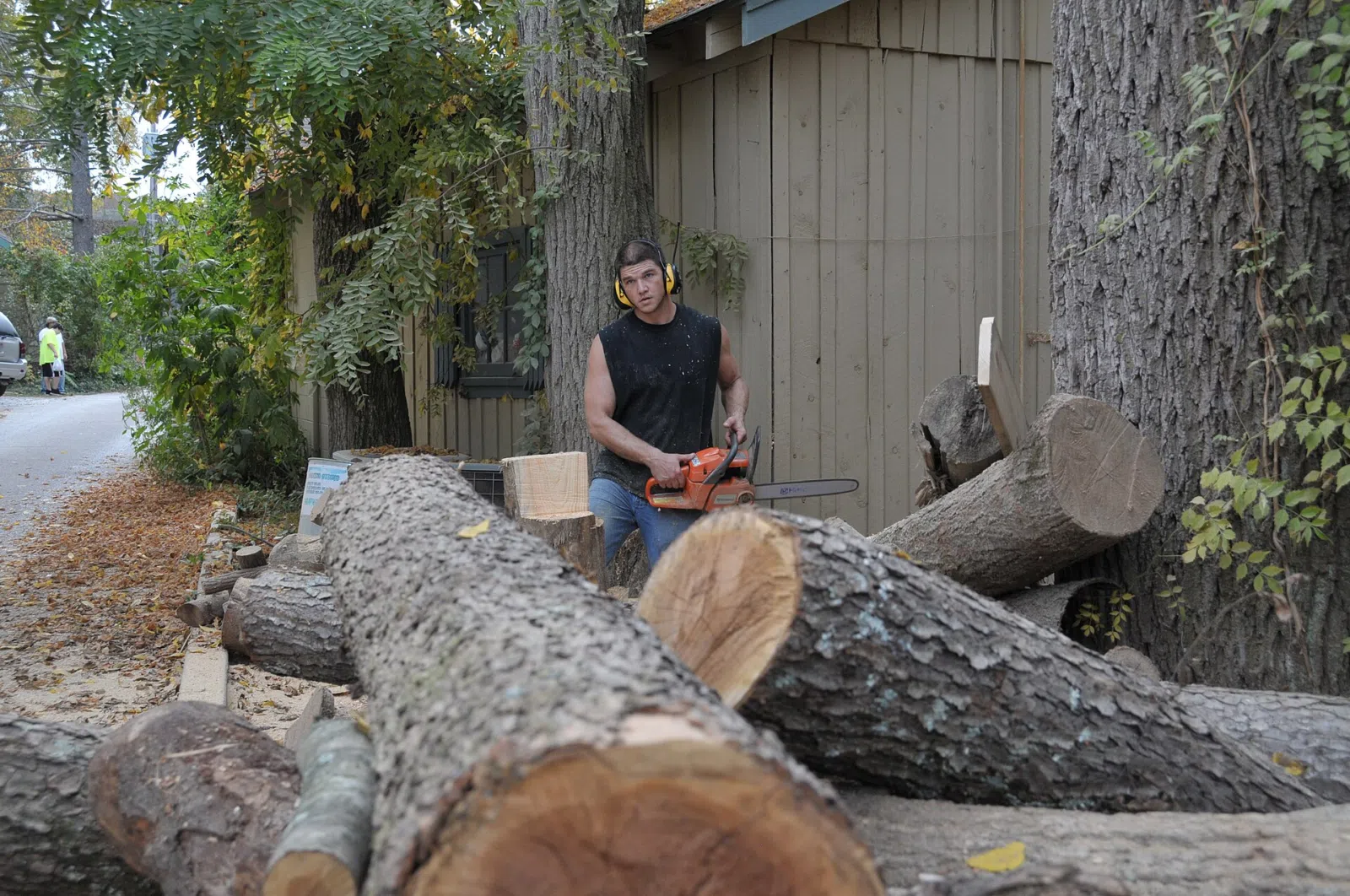 The artist behind that Angel Wooden Statue. I was lucky to catch him doing another one. - SOOC