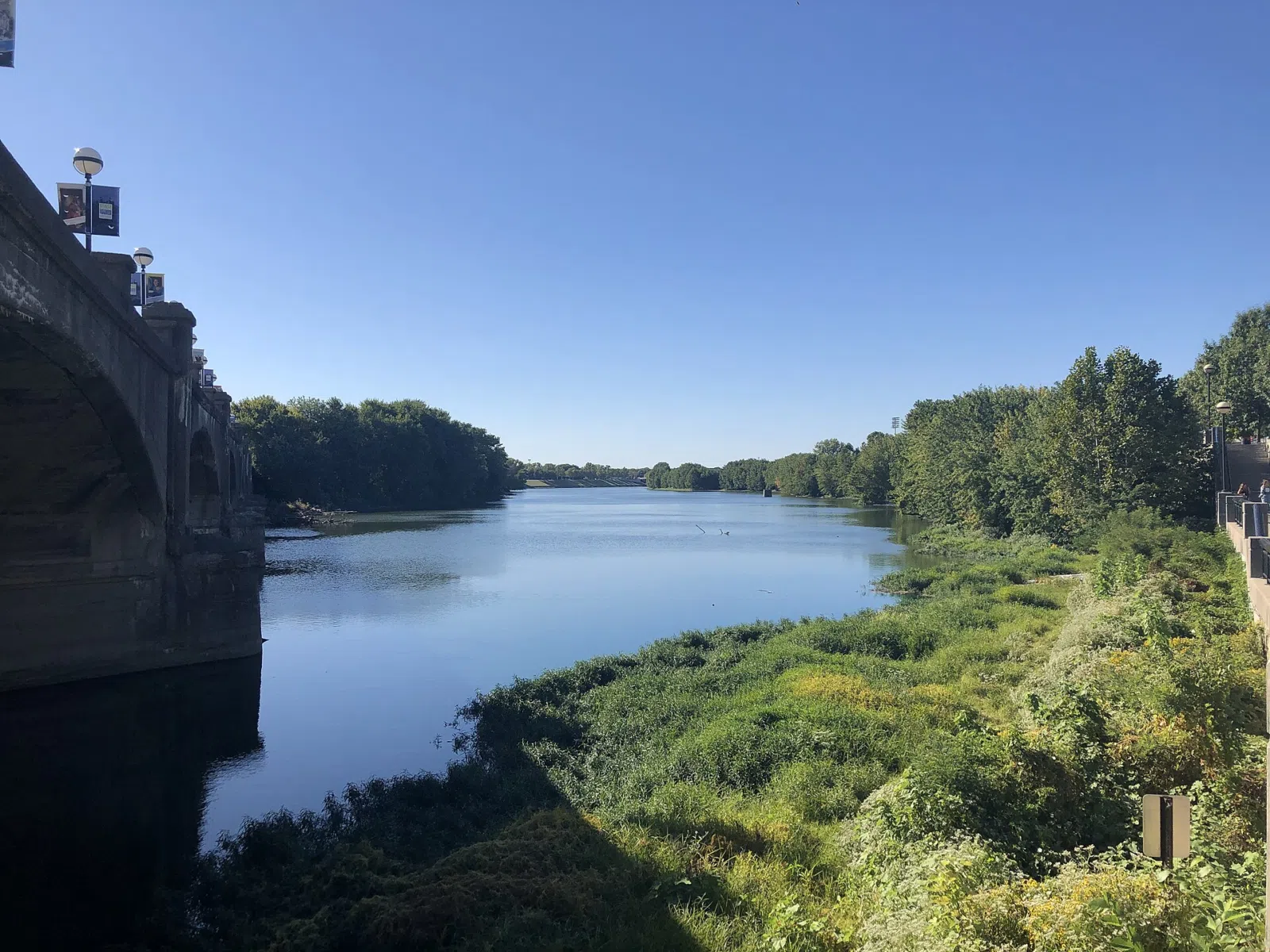 Nearby Indianapolis landmark: This photo depicts the White River from White River State Park at the old Washington Street bridge in Indianapolis,…