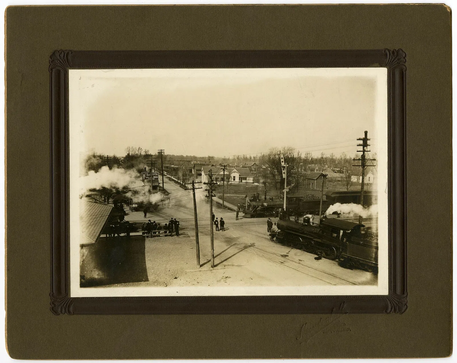 Nearby Tipton landmark: Four trains approaching an intersection with people gathered around them, possibly in Tipton, Indiana.