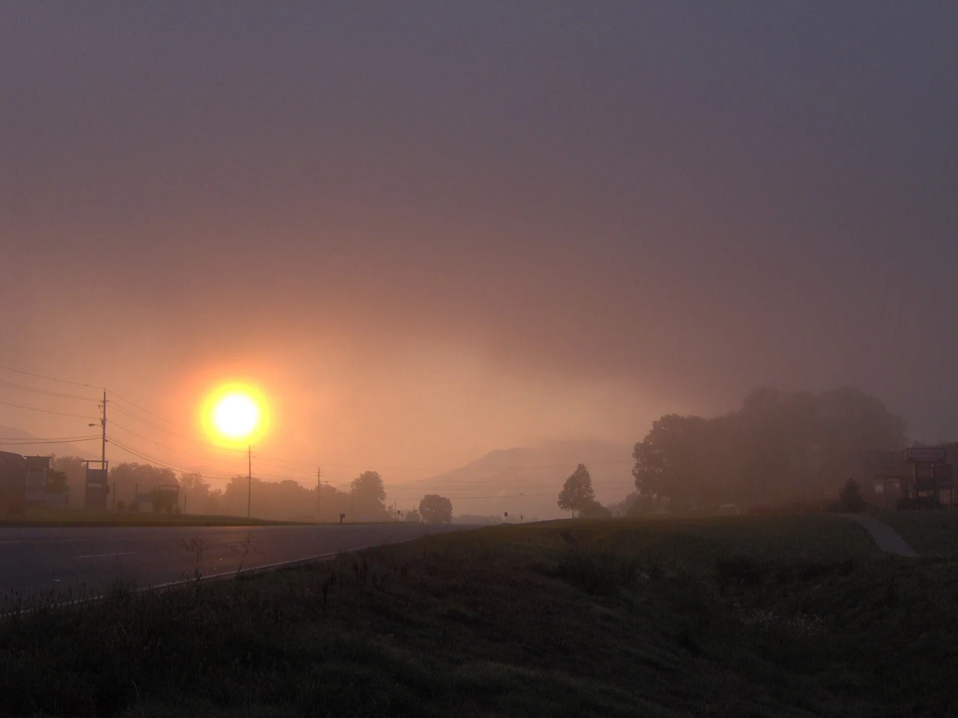 Sunrise over U.S. Route 321 in Townsend, Tennessee (Tuckaleechee Cove), with Rich Mountain in the distance