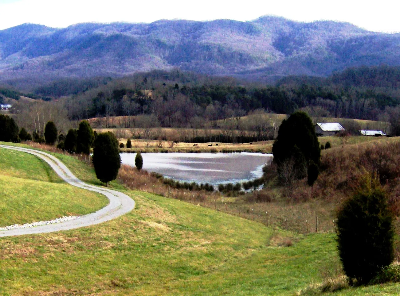 A retention pond near the Wildwood community in Blount County, Tennessee, with Chilhowee Mountain on the horizon