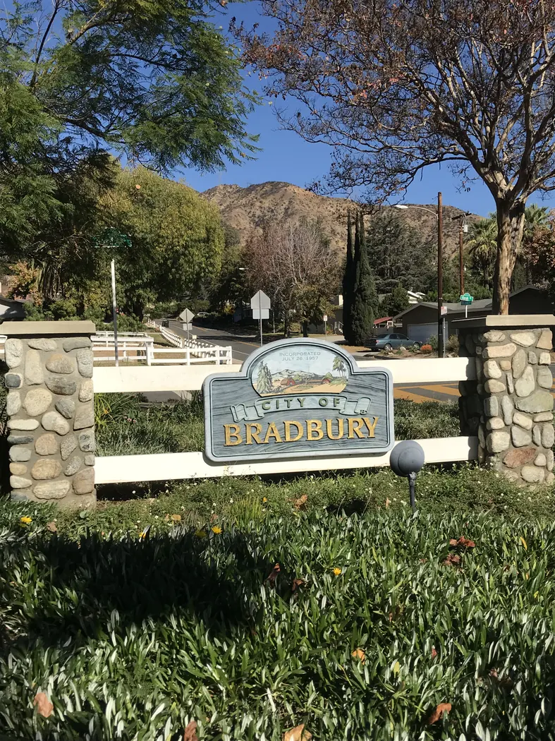 An entrance sign visible to visitors of Bradbury, California