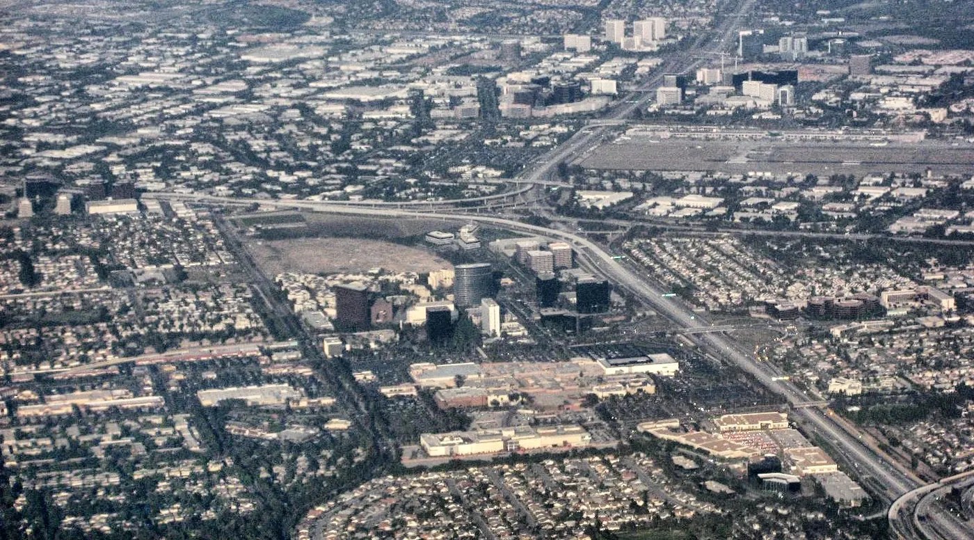 Aerial view of central Orange County overlooking South Coast Metro, John Wayne Airport, and the Irvine business district..