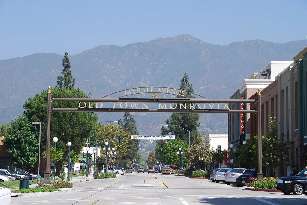 The Old Town Monrovia arch across Myrtle Avenue, viewed from street level.