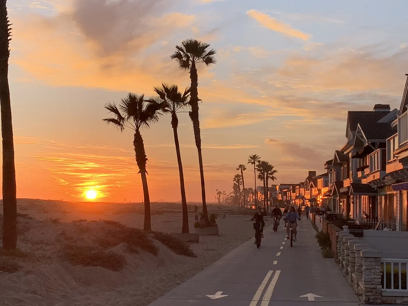 Sunset on Newport Beach Oceanfront Boardwalk.