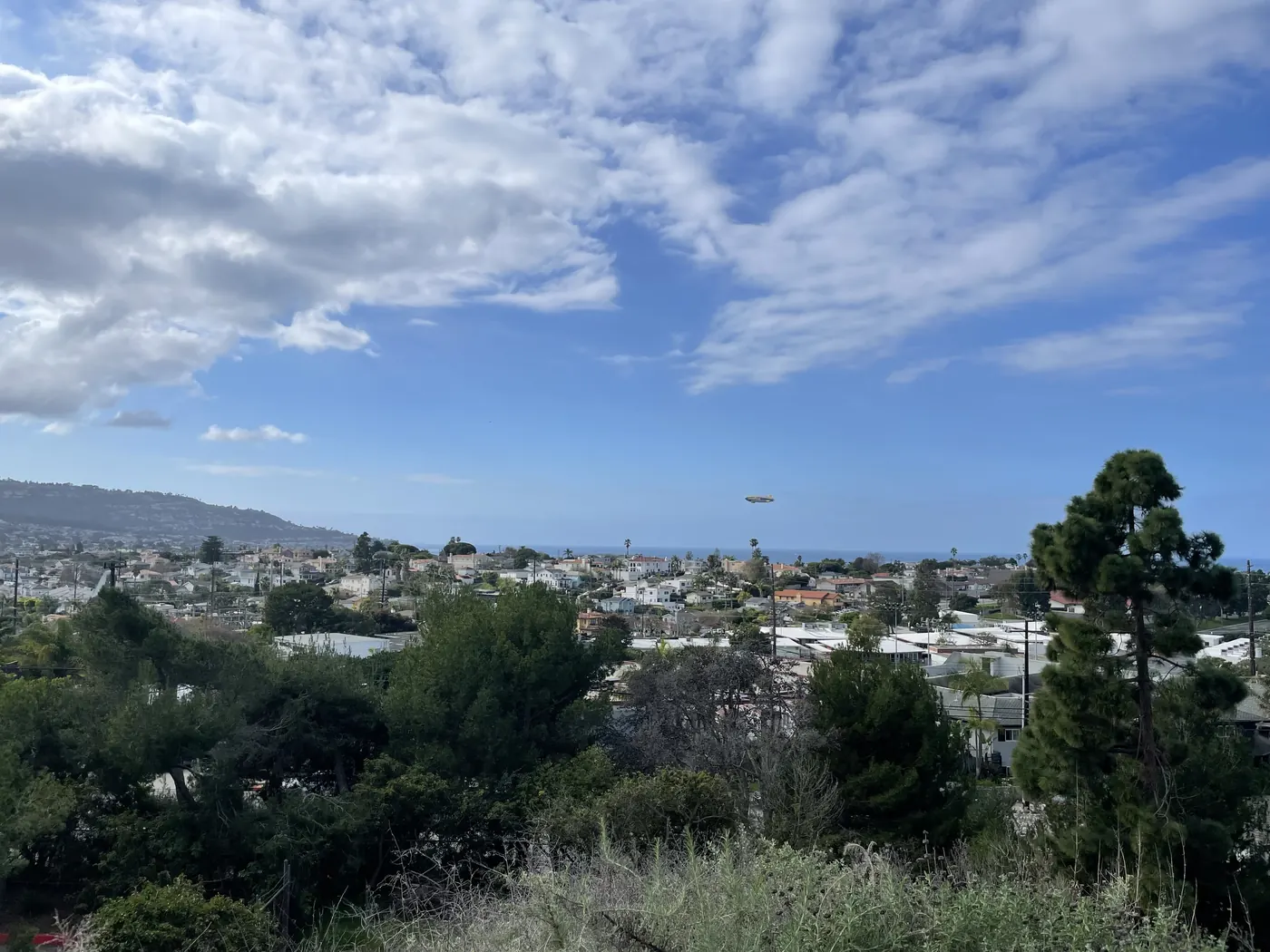 Goodyear blimp flying low over Torrance and Redondo Beach. Photo taken from Hopkins Wilderness park in Redondo Beach