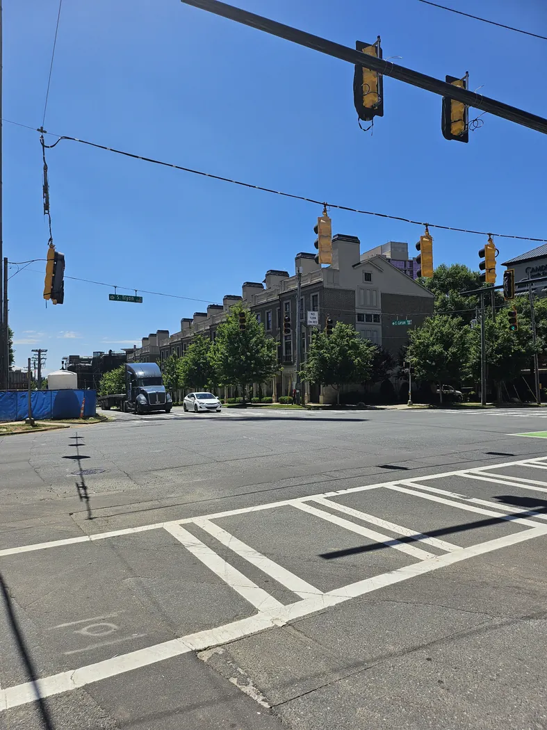 East Carson Ave Townhomes viewed from West Carson and South Tryon St in May 2024