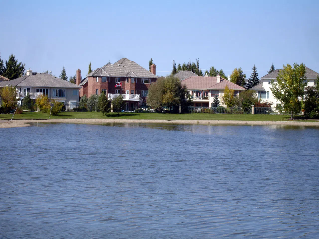 Homes in Briarwood, Saskatoon situated on the shores of Briarwood Lake.