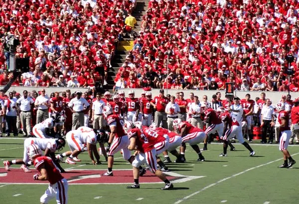 The Wisconsin Badgers college football team on offense against the Oregon State Beavers near midfield at Camp Randall Stadium in Madison, Wisconsin, USA.