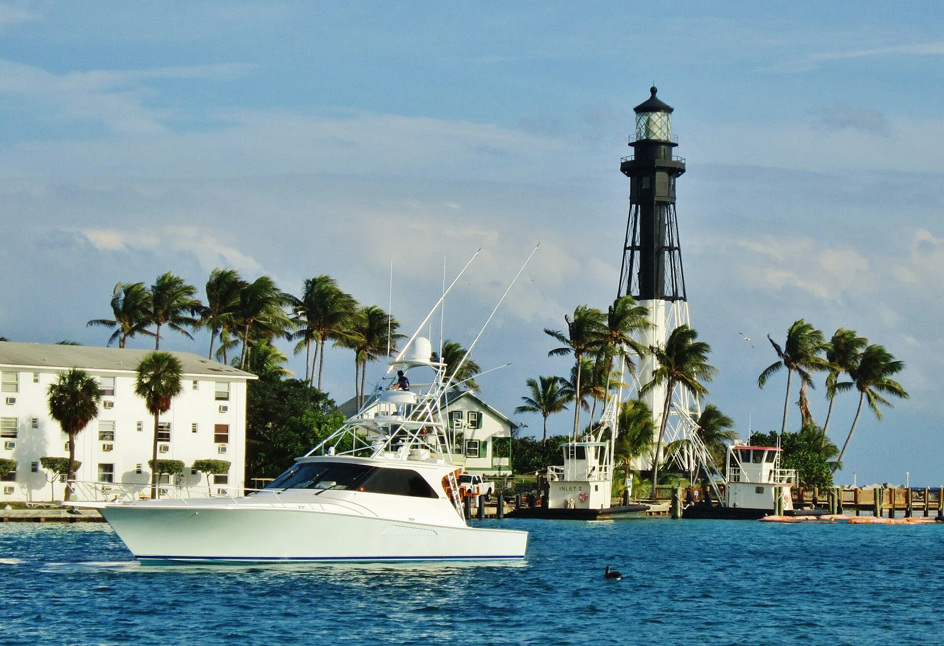 Boat sailing in the Hillsboro Inlet at Lighthouse Point, Florida (the inlet forms the city's northern/eastern edge).