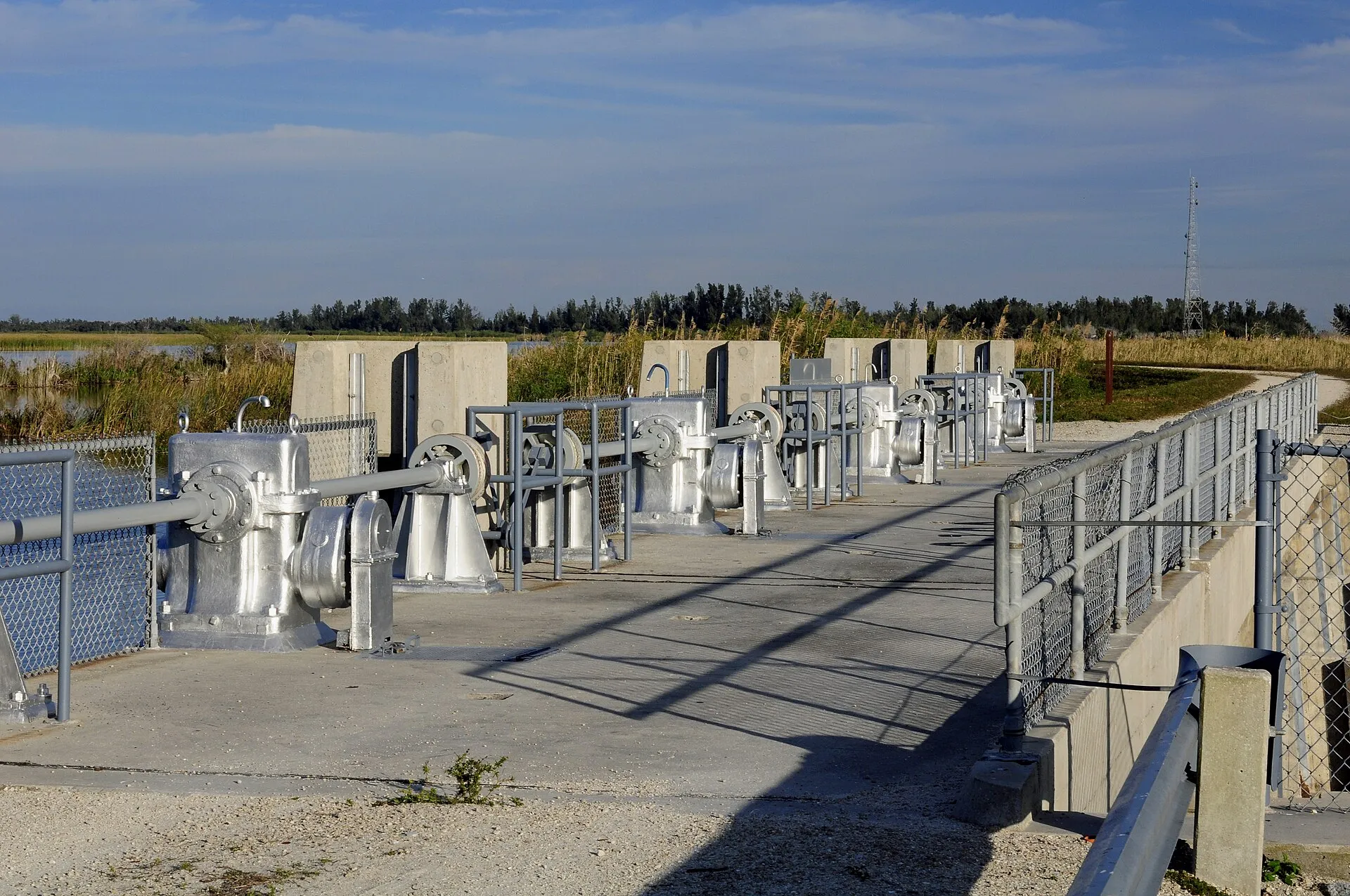 Water control gates (canal gates typical of Parkland's water-management landscape).