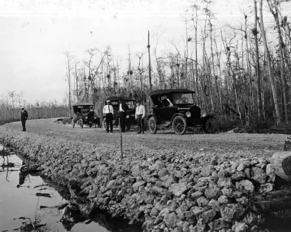 Cars parked along the Tamiami Trail.