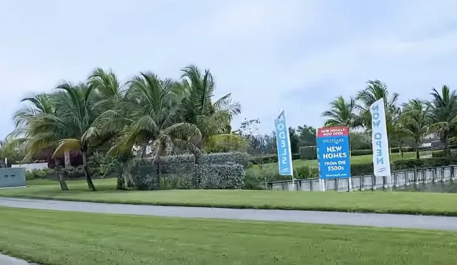 Signs directing buyers to the Westlake, Florida development.