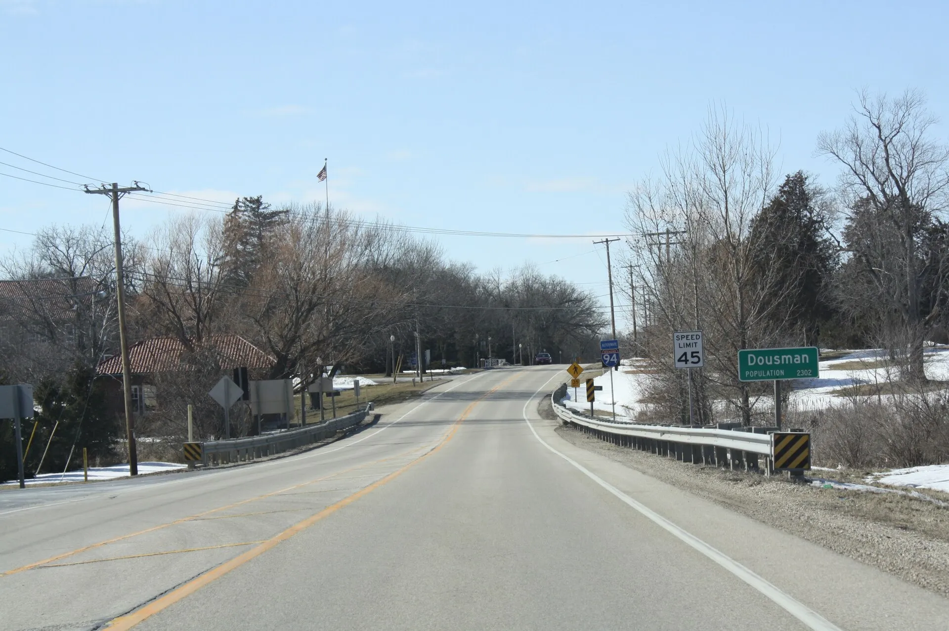 Looking west at the sign for Dousman, Wisconsin on U.S. Route 18.