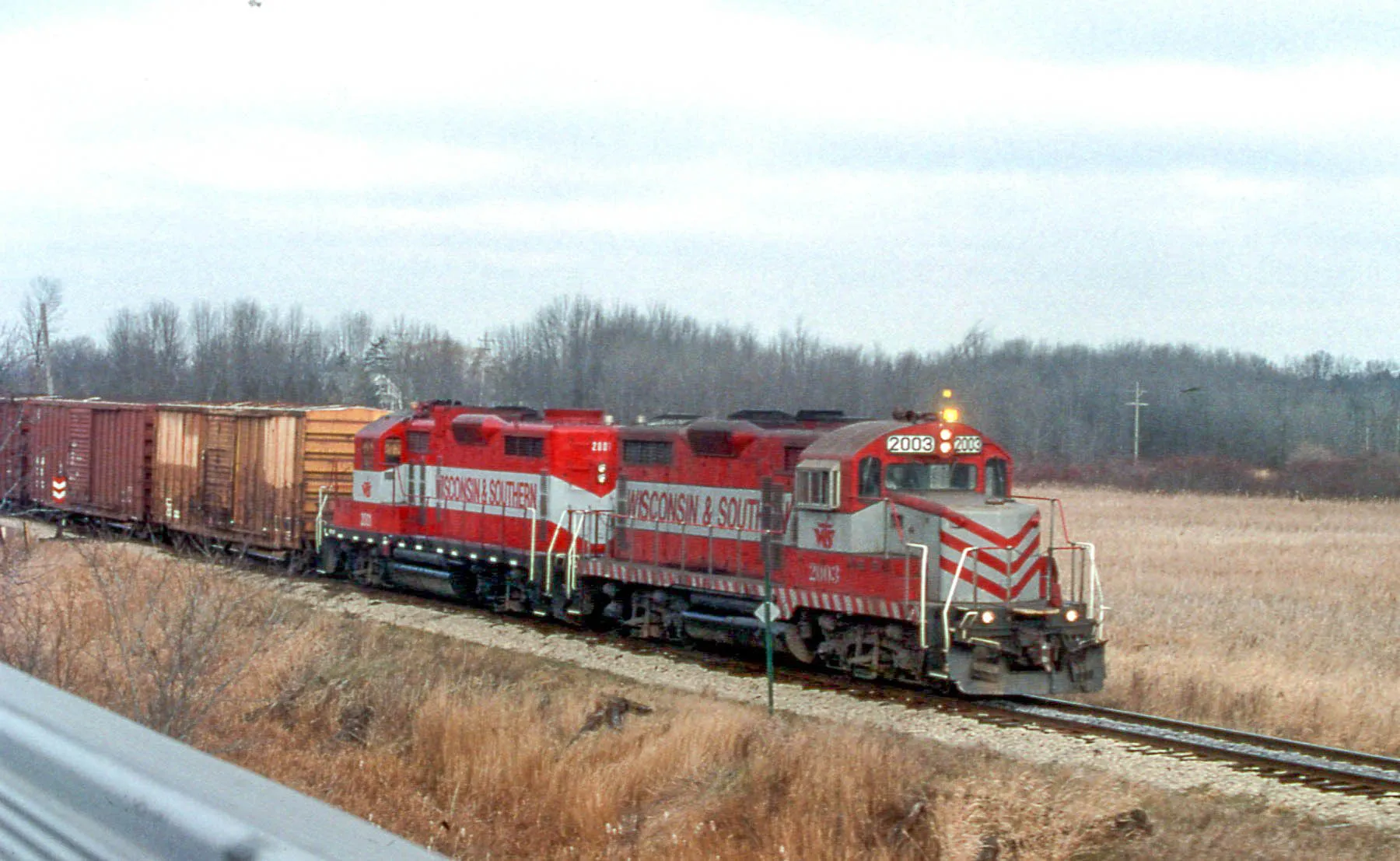 Two red Wisconsin Southern diesel locomotives at Slinger, WI.