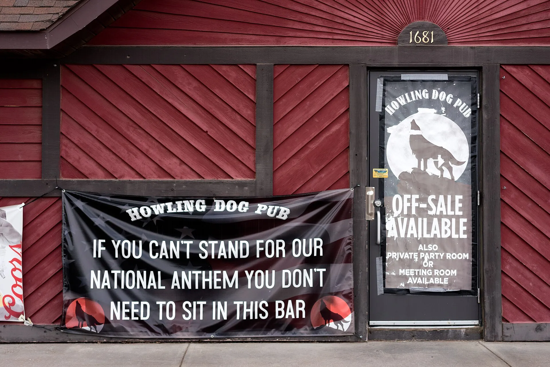 Howling Dog Pub Banner "If you can't stand for our national anthem you don't need to sit in this bar" Bock, Minnesota, USA Photo by Lorie Shaull Please attribute to Lorie Shaull if used elsewhere.