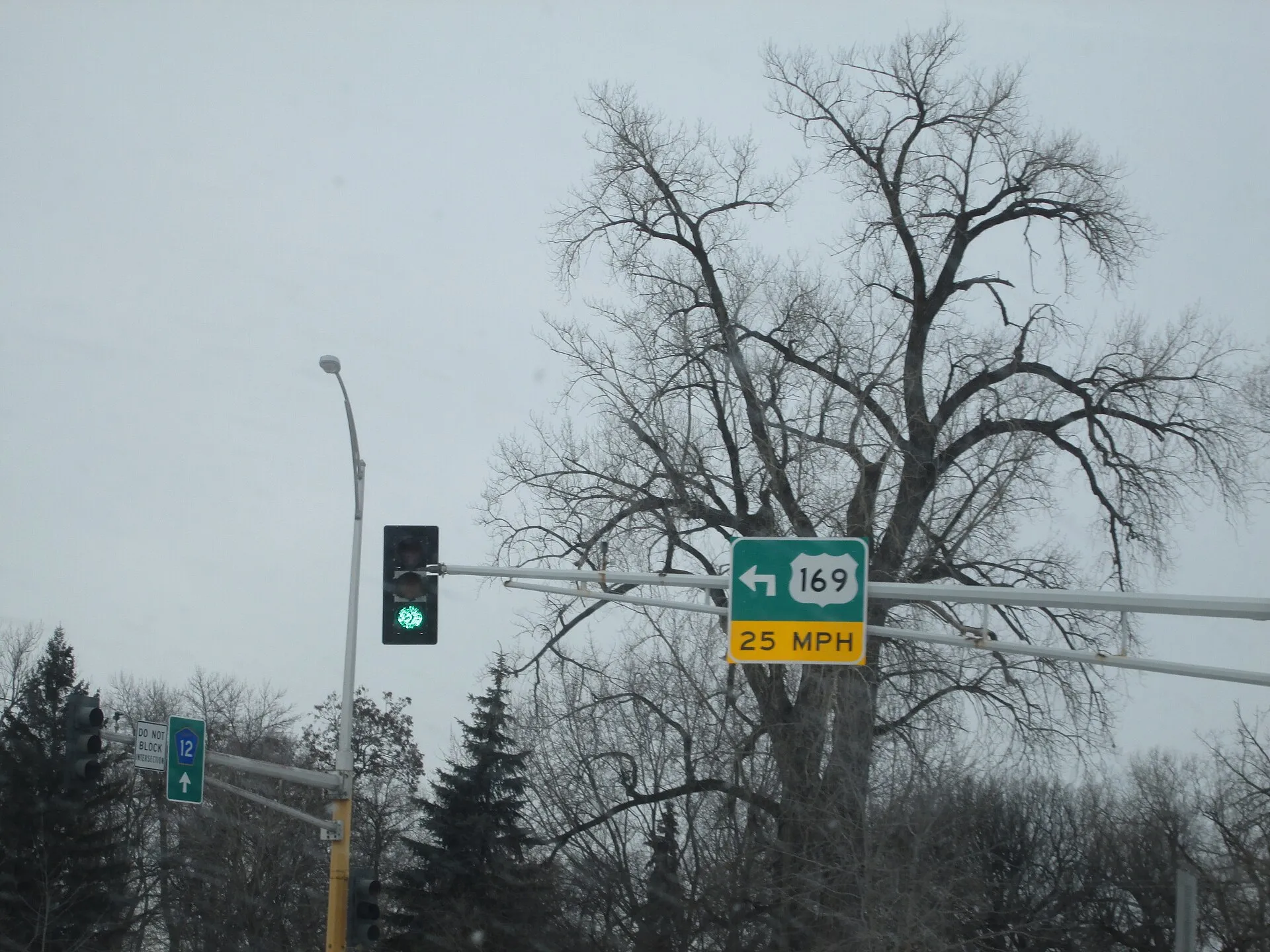 This is U.S. Highway 169 and Hennepin CSAH 12 intersecting in Champlin, Minnesota. US 169 crosses the Mississippi River after the split..
