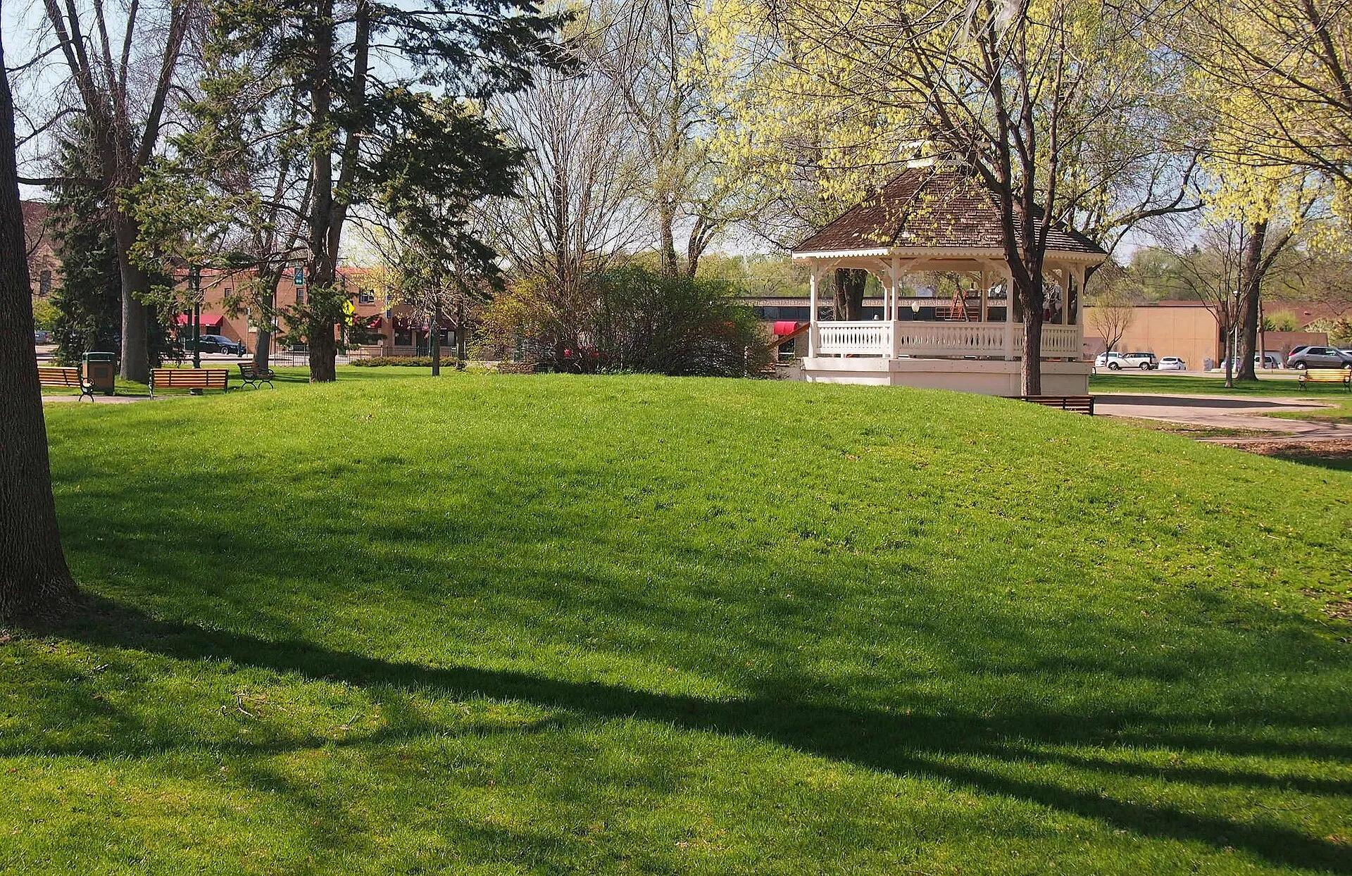 Public Square with gazebo and Native American burial mound, Chaska, Minnesota, USA. Viewed from the southeast. Mound is a contributing property to the Walnut