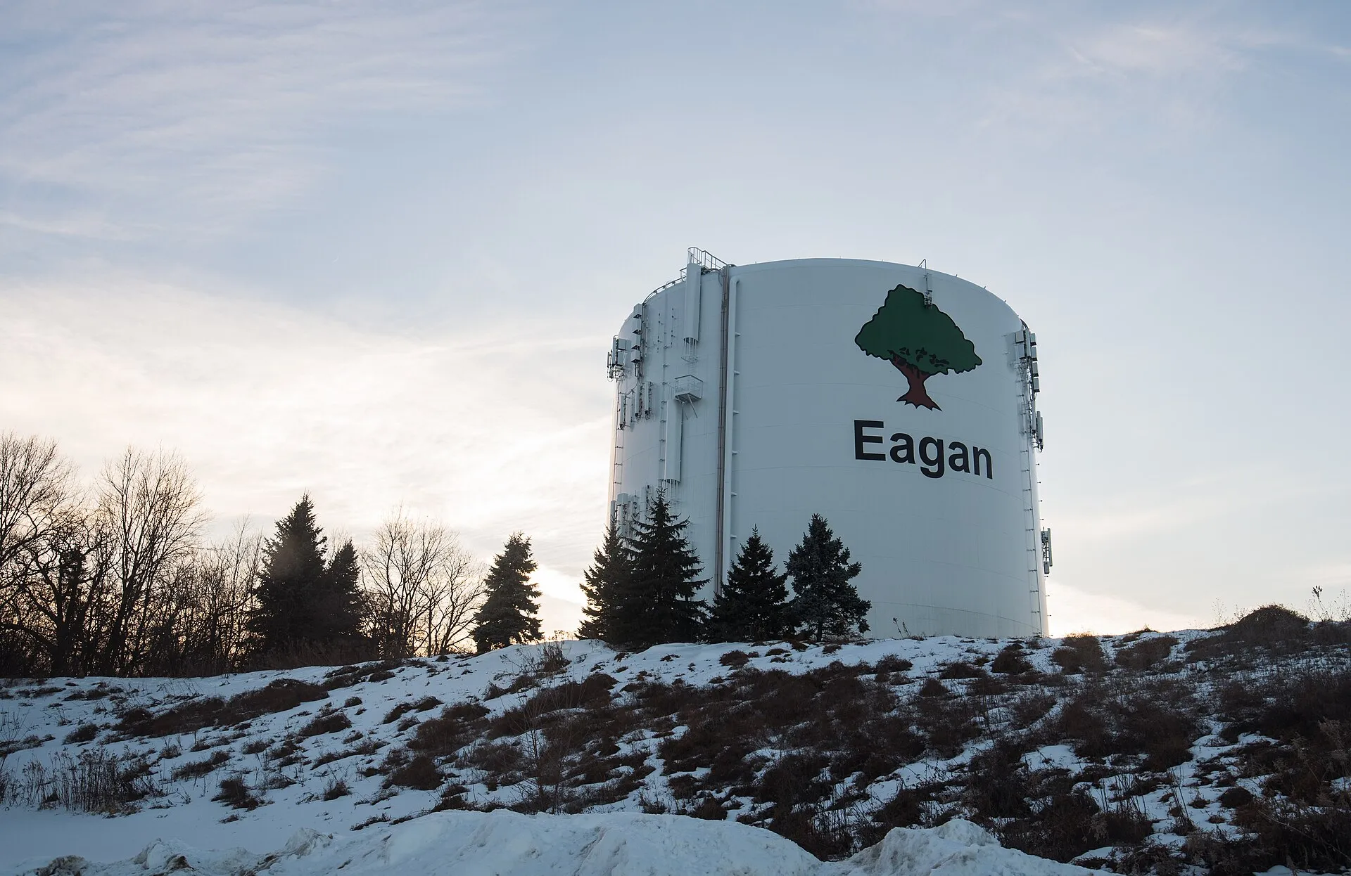 A City of Eagan, Minnesota watertower at sunset in winter.